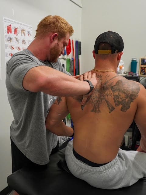 Dr. Taylor Foster providing physical therapy treatment